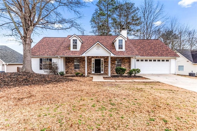 cape cod house featuring a garage, central AC, and a front yard