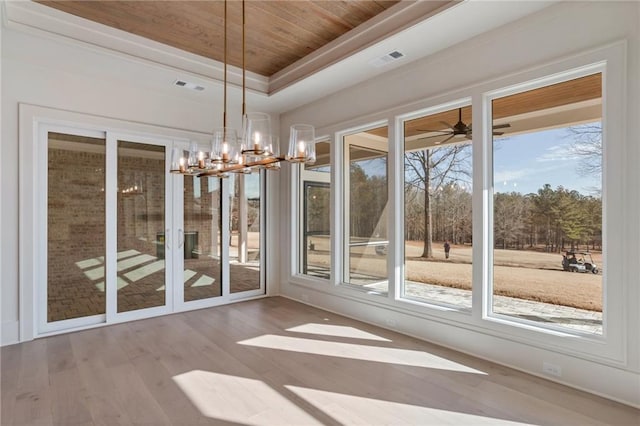 unfurnished dining area with a notable chandelier, light hardwood / wood-style floors, a raised ceiling, and wooden ceiling
