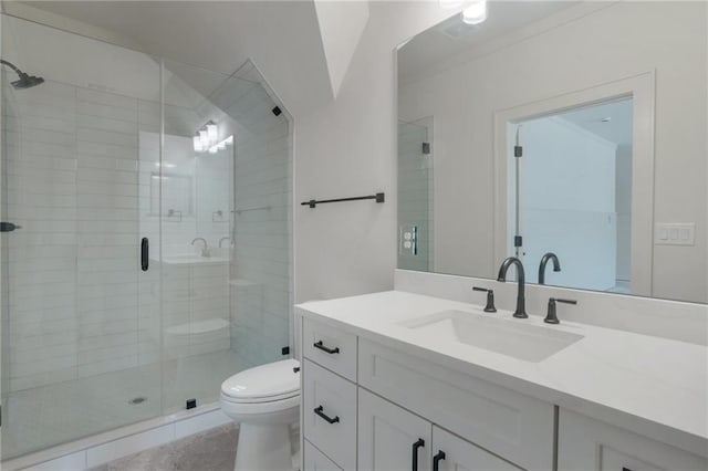 bathroom featuring vanity, toilet, a shower with shower door, and tile patterned flooring