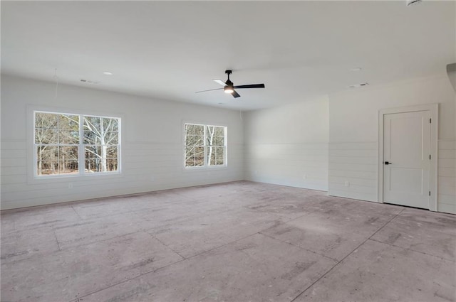 unfurnished room with ceiling fan