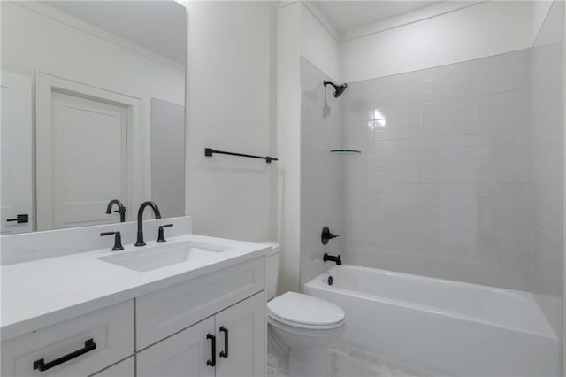 full bathroom with tiled shower / bath, vanity, and toilet