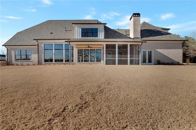 back of house featuring a sunroom and ceiling fan