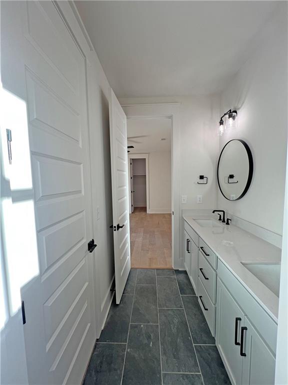 bathroom featuring vanity and wood-type flooring