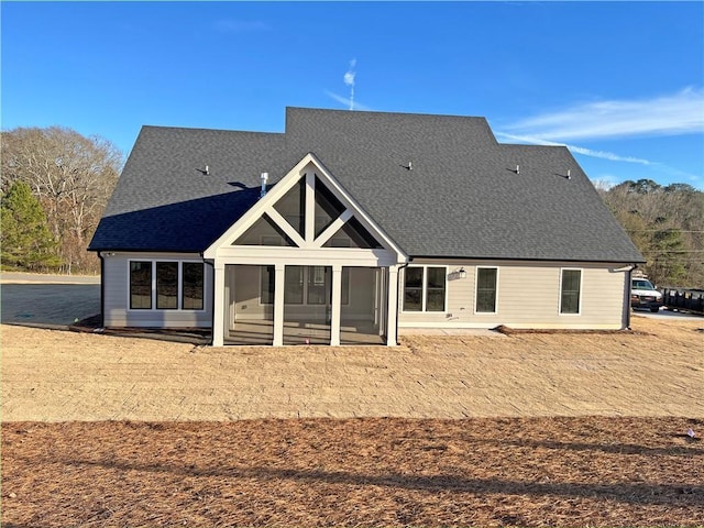 back of house with a sunroom and a patio