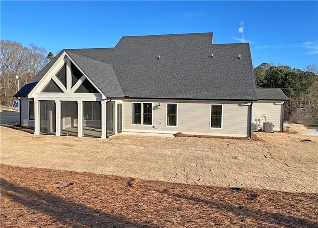 back of property with a patio area, cooling unit, and a sunroom