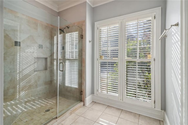 bathroom featuring tile patterned flooring, a shower with door, and ornamental molding