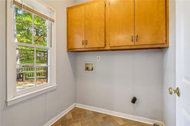 laundry room featuring cabinets and washer hookup