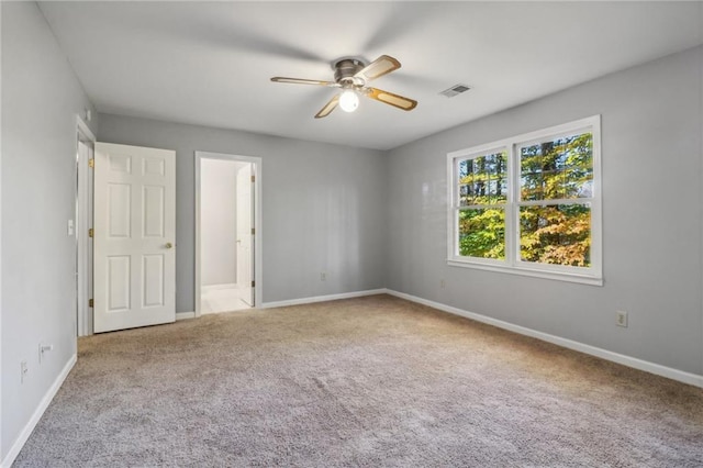 carpeted empty room with ceiling fan