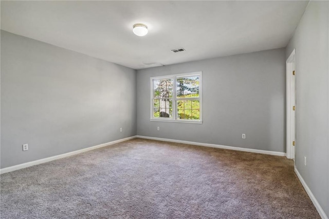 unfurnished room featuring carpet