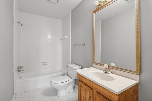 full bathroom with tile patterned flooring, vanity, tiled shower / bath combo, and toilet