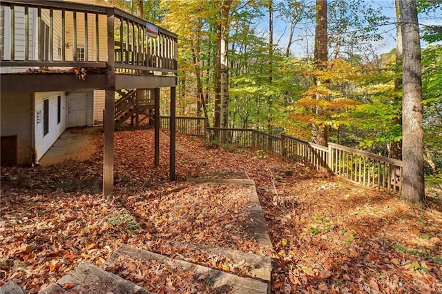 view of yard featuring a wooden deck