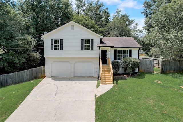 split level home featuring a garage and a front yard