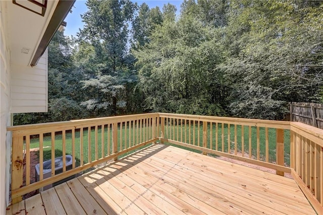 deck featuring a lawn