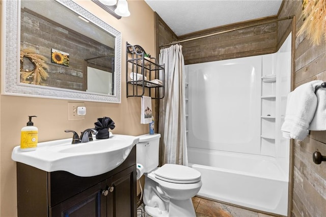 full bathroom with vanity, a textured ceiling, toilet, and shower / tub combo with curtain