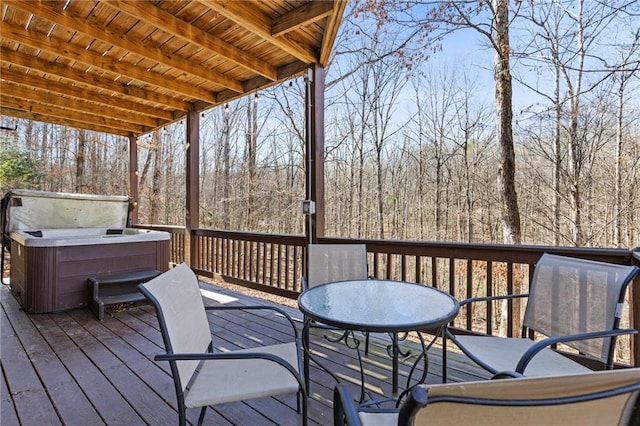 wooden terrace featuring a hot tub