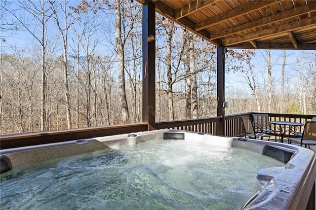 deck featuring a hot tub