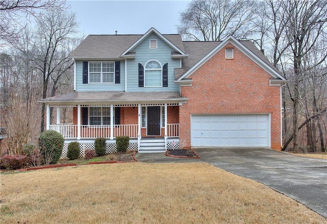 view of property featuring a front yard, a porch, and a garage