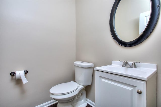 bathroom with toilet and vanity