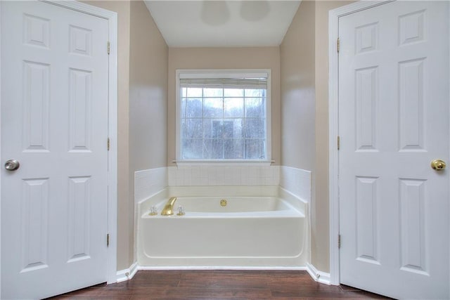 bathroom featuring a bathing tub and hardwood / wood-style flooring