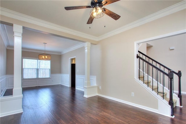 unfurnished living room with ceiling fan, dark hardwood / wood-style flooring, crown molding, and ornate columns