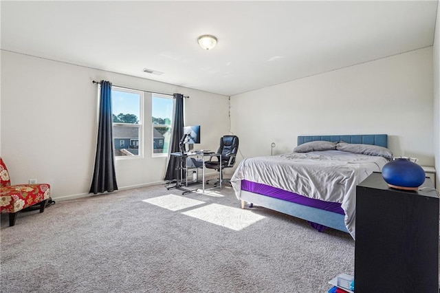 bedroom featuring carpet floors, visible vents, and baseboards