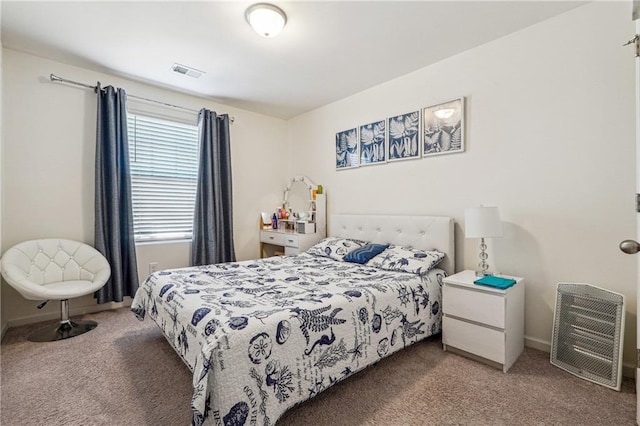 carpeted bedroom with visible vents and baseboards