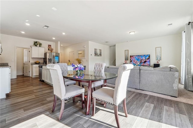 dining room featuring recessed lighting, visible vents, and wood finished floors