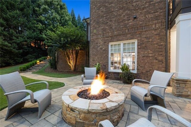 view of patio with an outdoor fire pit