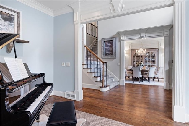 miscellaneous room featuring coffered ceiling, an inviting chandelier, crown molding, and dark wood-type flooring