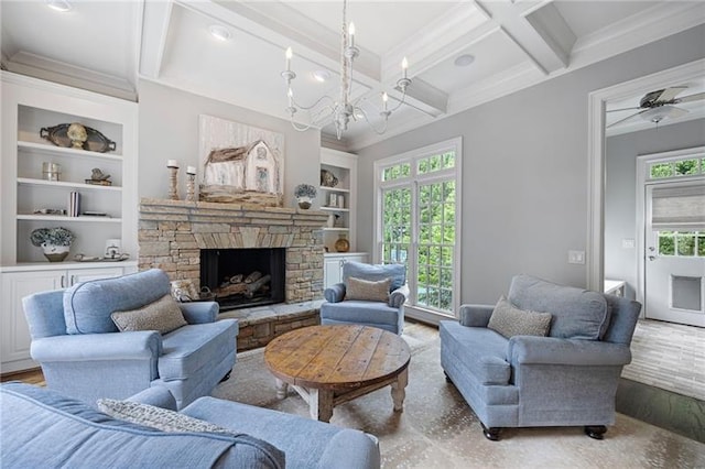 living room featuring coffered ceiling, a fireplace, hardwood / wood-style floors, and built in shelves