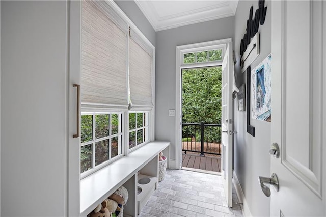 entryway featuring crown molding