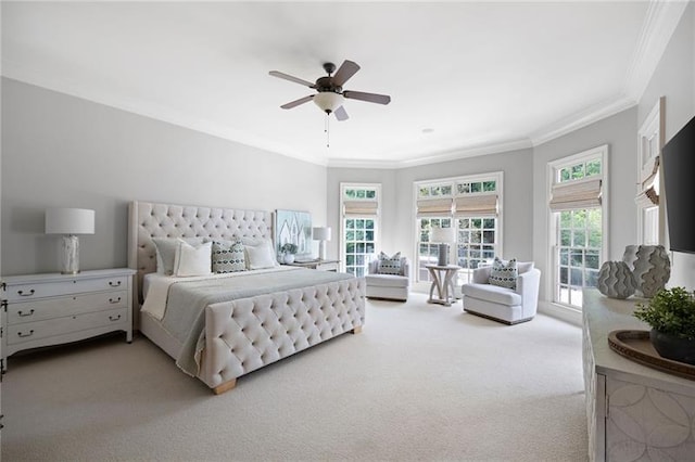 carpeted bedroom with ceiling fan, access to outside, and crown molding