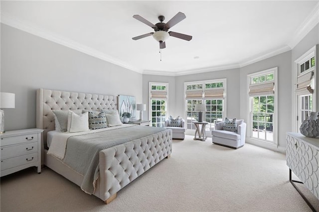 carpeted bedroom with access to outside, ceiling fan, and crown molding