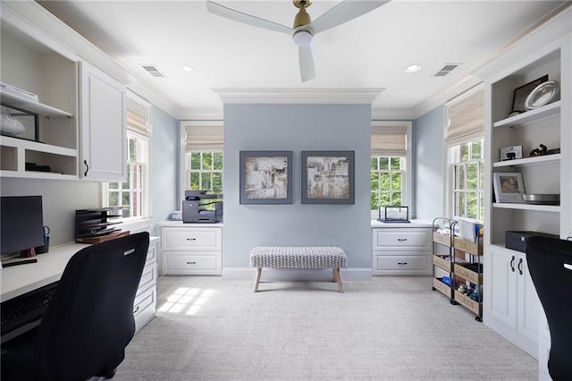 office space featuring light colored carpet, ceiling fan, and a wealth of natural light