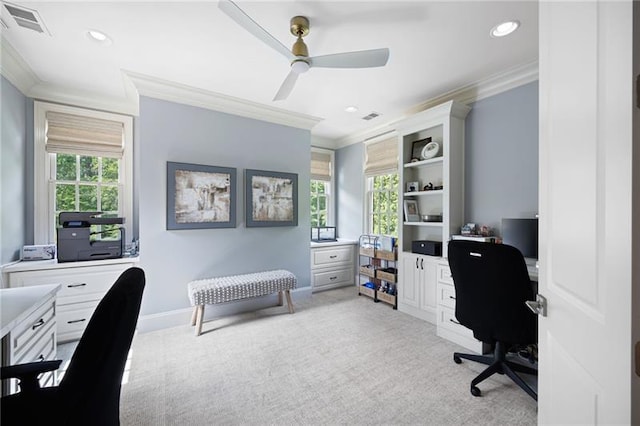 carpeted office featuring ceiling fan and crown molding