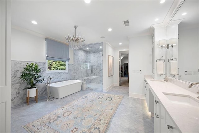 bathroom with crown molding, vanity, tile walls, separate shower and tub, and an inviting chandelier