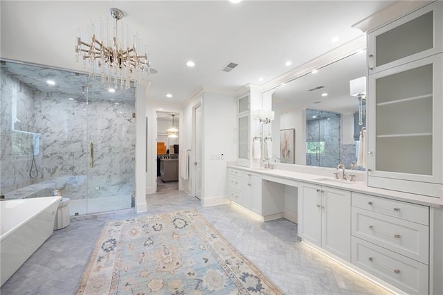 bathroom with vanity, an inviting chandelier, ornamental molding, and plus walk in shower