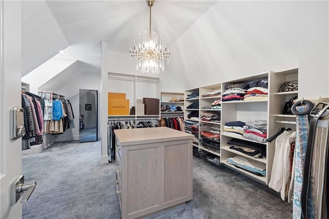 walk in closet featuring a chandelier, vaulted ceiling, and dark carpet