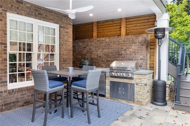 view of patio featuring a grill, ceiling fan, and area for grilling