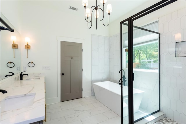 full bathroom with visible vents, double vanity, marble finish floor, a chandelier, and a soaking tub