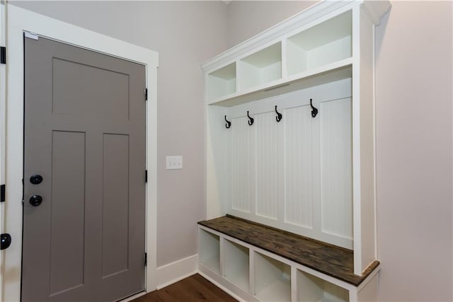 mudroom with baseboards and dark wood finished floors