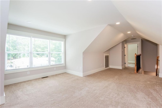 bonus room with carpet flooring, visible vents, recessed lighting, baseboards, and vaulted ceiling