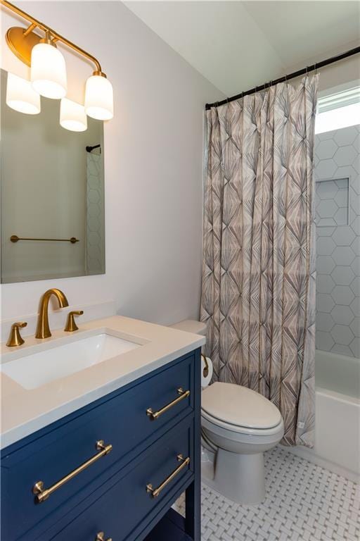 full bathroom featuring vanity, shower / bathtub combination with curtain, and toilet