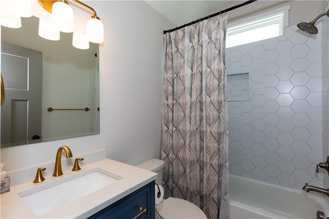 full bathroom with vanity, shower / tub combo with curtain, and toilet