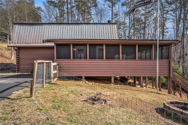 view of front of house with a fire pit