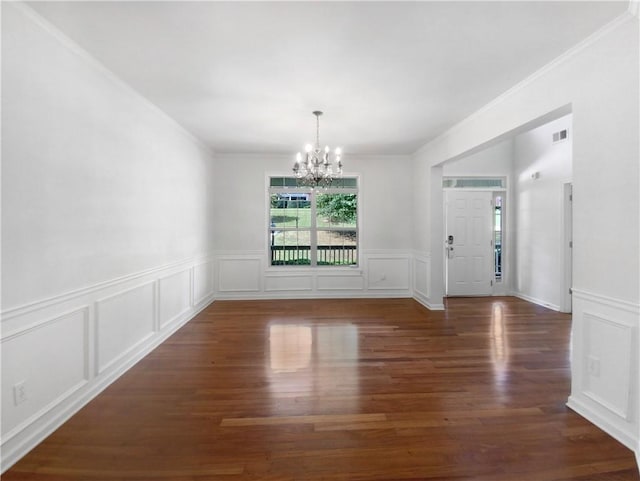 unfurnished dining area with ornamental molding, a notable chandelier, and dark hardwood / wood-style flooring