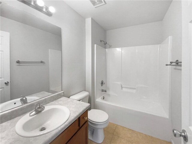 full bathroom featuring vanity, toilet,  shower combination, and tile patterned floors