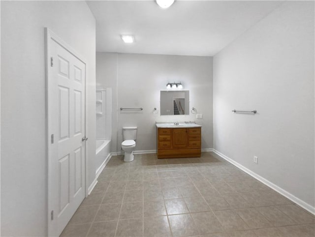 bathroom featuring vanity, tile patterned flooring, and toilet