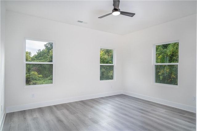 unfurnished room featuring hardwood / wood-style flooring and ceiling fan