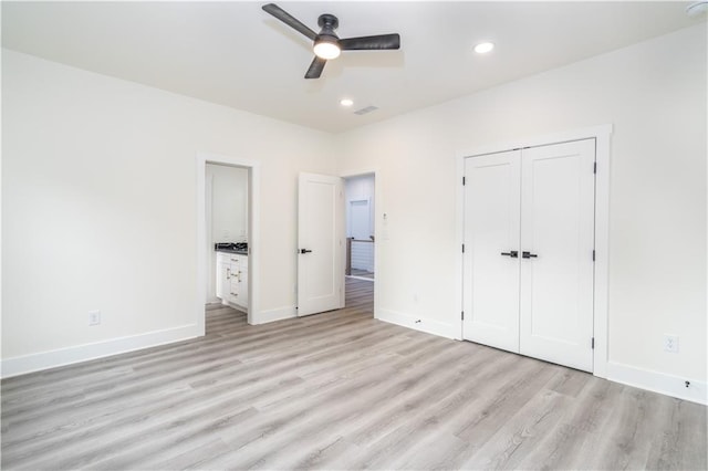 unfurnished bedroom with a closet, ceiling fan, and light hardwood / wood-style floors